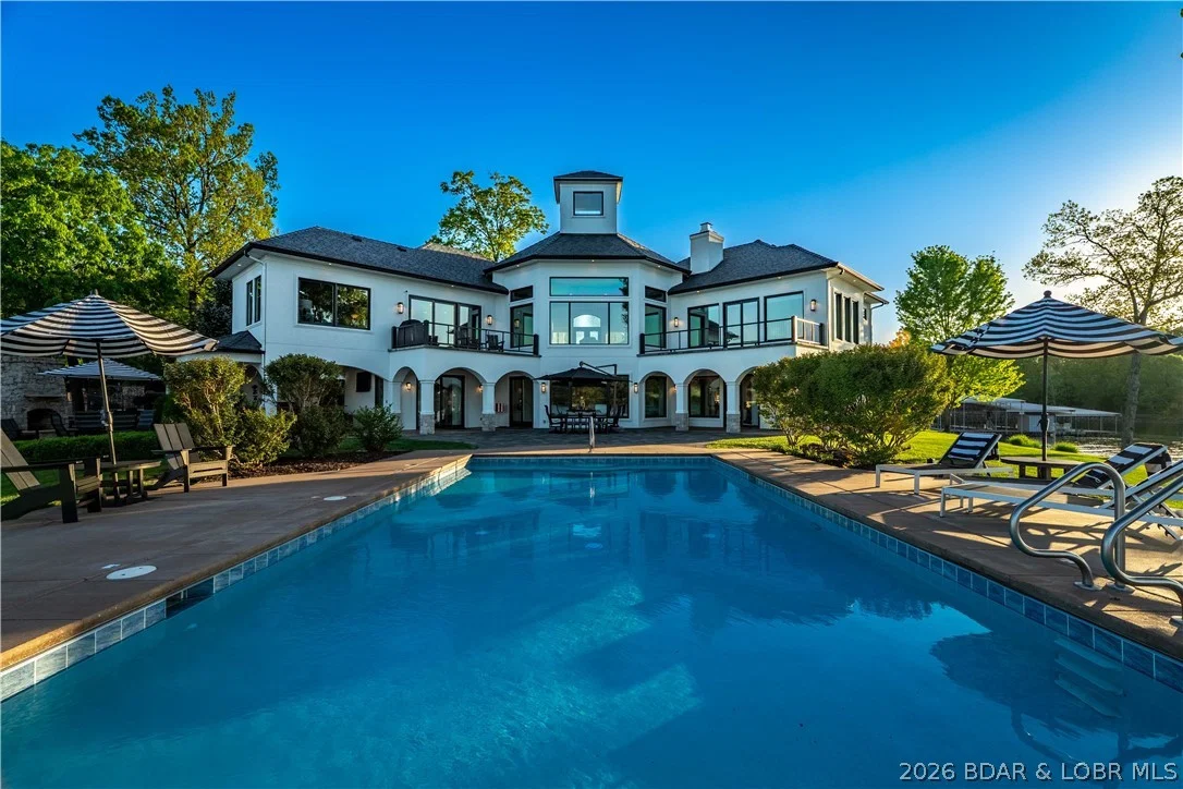 Lakefront estate with infinity pool over the water